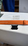 Bracelet STAMPS orange Tangerine posé sur table