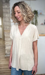 Blouse beige coupe droite longueur hanches 