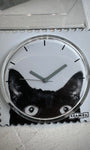 Gros plan cadran STAMPS chat yeux expressifs 