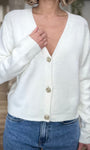 Détail col V gilet blanc bijou