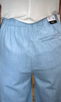 Détail poche passepoilée au dos pantalon femme 