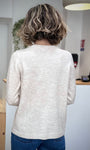 Vue arrière du pull beige