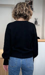 Dos du pull col V et coupe loose