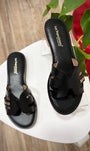 Sandales plates noires en cuir avec brides larges 