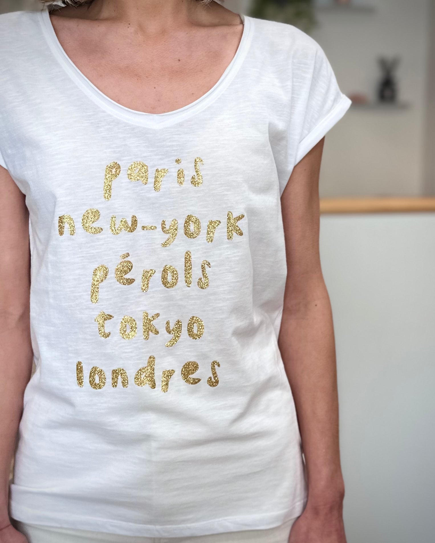 Détail imprimé Paris New-York Pérols Tokyo Londres doré 