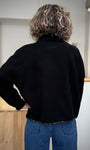 Mannequin de dos montrant la coupe oversize